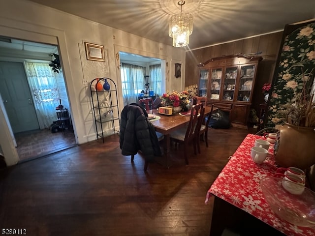 dining area featuring a chandelier and dark hardwood / wood-style floors