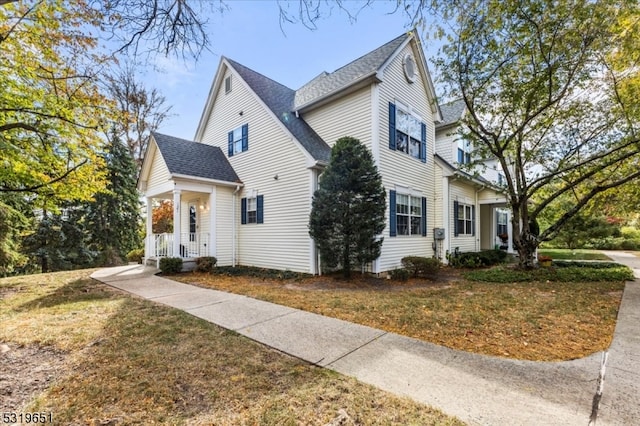 view of side of home featuring a yard