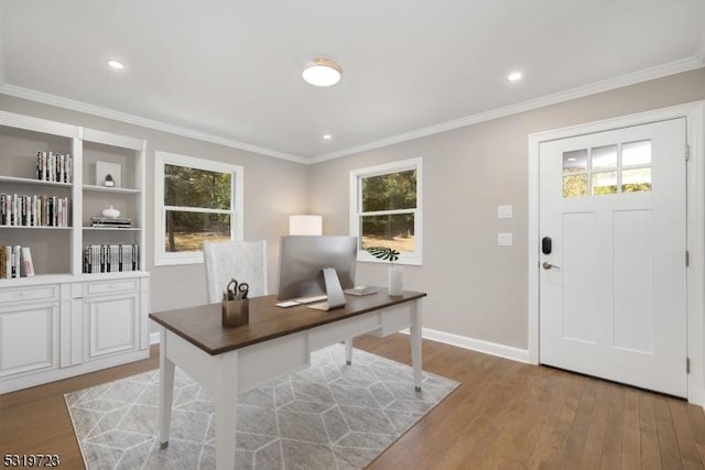 office with baseboards, recessed lighting, ornamental molding, and light wood-style floors