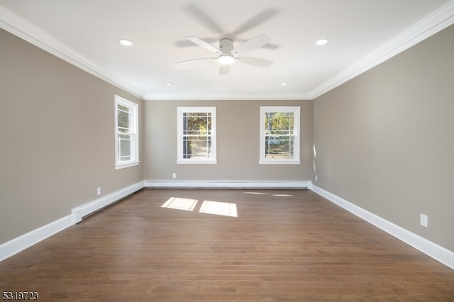 spare room featuring a baseboard radiator, ceiling fan, ornamental molding, and dark hardwood / wood-style flooring