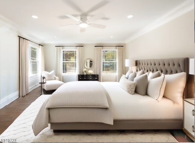 bedroom featuring ceiling fan, crown molding, and hardwood / wood-style floors