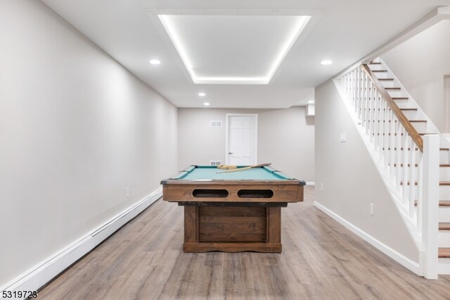 recreation room with wood-type flooring, a baseboard radiator, and pool table