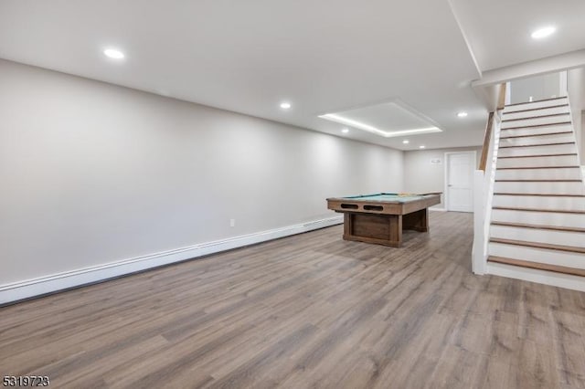recreation room with recessed lighting, a baseboard radiator, wood finished floors, and pool table