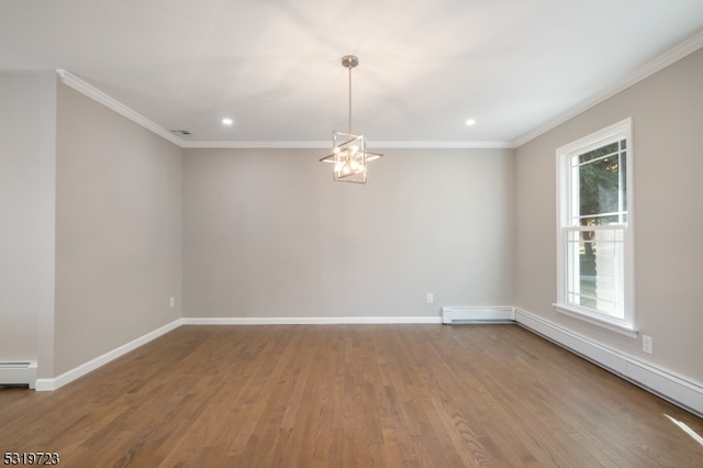 unfurnished room featuring a notable chandelier, a baseboard heating unit, and hardwood / wood-style floors