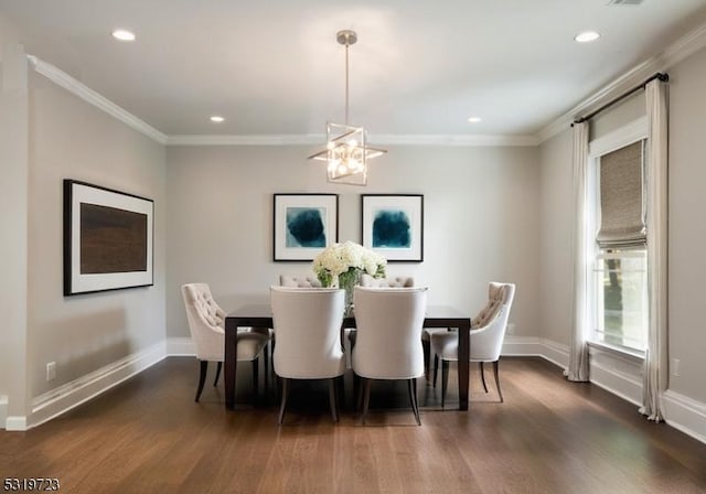 dining room with crown molding, dark wood-style flooring, and baseboards