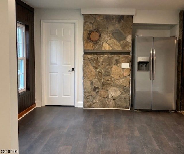 spare room featuring dark hardwood / wood-style flooring and a healthy amount of sunlight