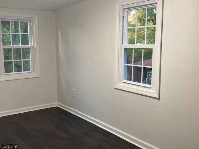 empty room featuring dark hardwood / wood-style floors