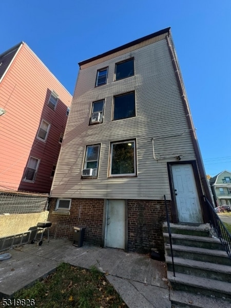 rear view of property with a patio area