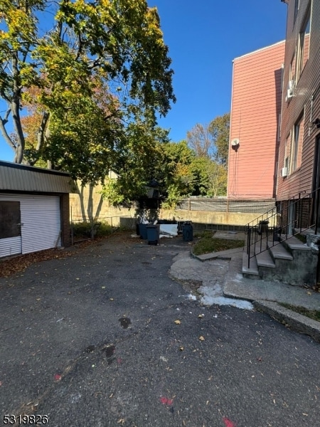 view of yard with an outbuilding and a garage