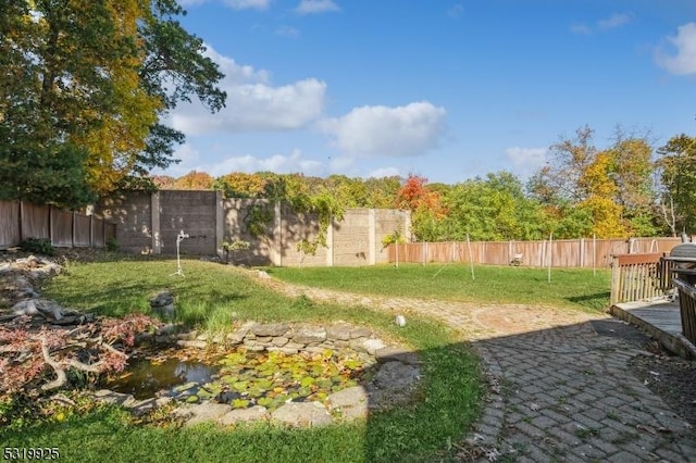 view of yard with a fenced backyard