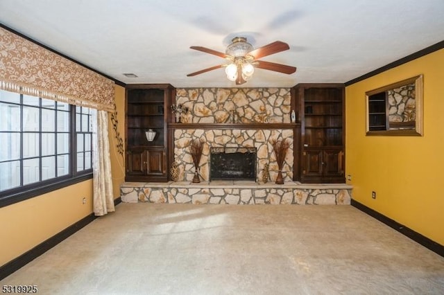 unfurnished living room featuring baseboards, a ceiling fan, and carpet