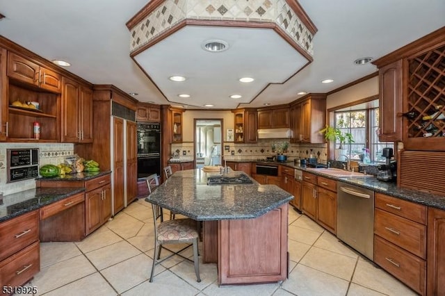 kitchen featuring a sink, tasteful backsplash, open shelves, under cabinet range hood, and appliances with stainless steel finishes