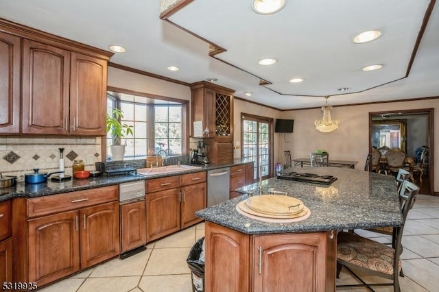 kitchen featuring a sink, light tile patterned floors, dishwasher, a kitchen bar, and a kitchen island