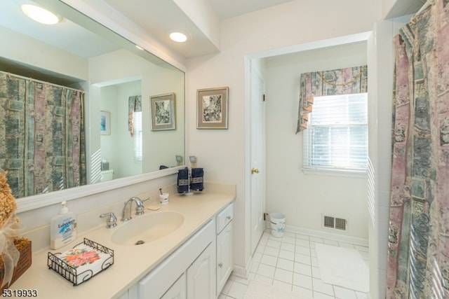 bathroom with vanity and tile patterned floors