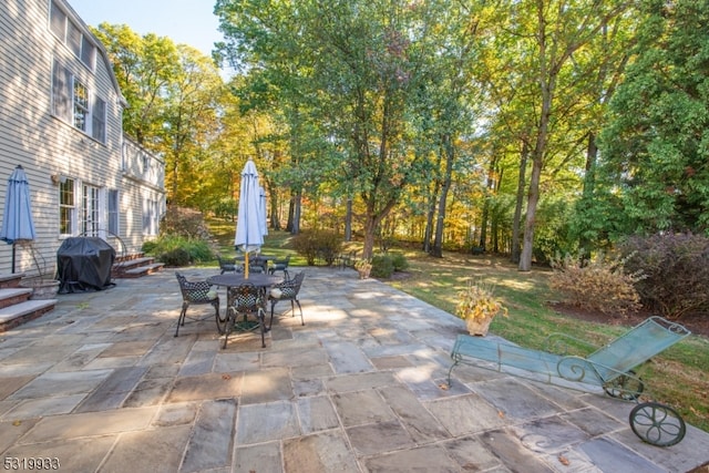 view of patio featuring a grill