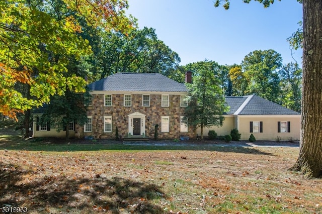 colonial house with a front lawn