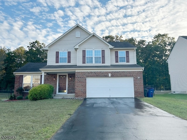 view of front property with a front yard and a garage