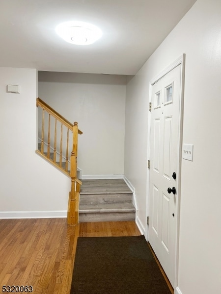 entrance foyer featuring hardwood / wood-style flooring