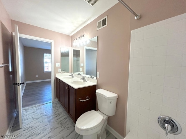 bathroom with vanity, toilet, walk in shower, and wood-type flooring