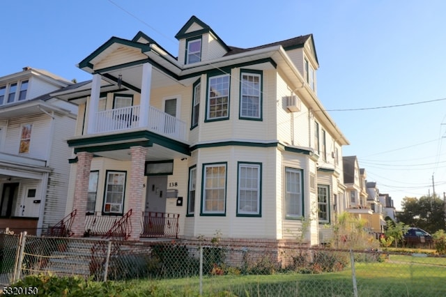 view of front of property with a balcony