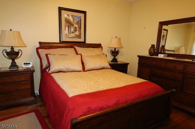 bedroom featuring dark wood-type flooring