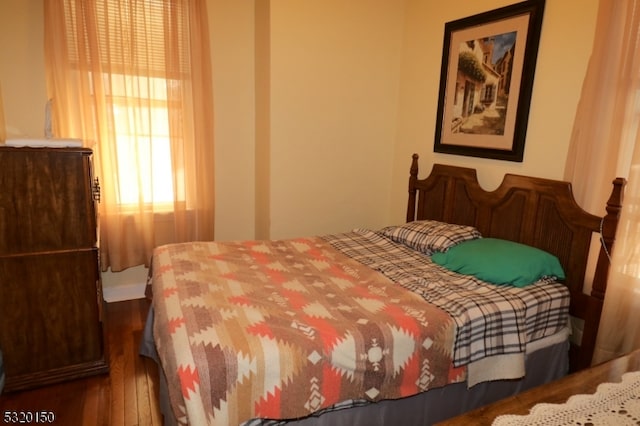 bedroom featuring hardwood / wood-style floors