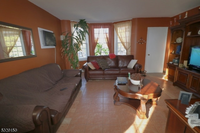 living room with light tile patterned flooring