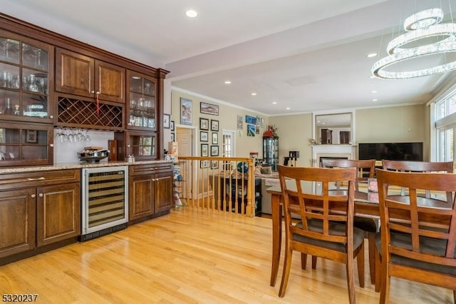 20 Crestview Ln, Sparta Twp, NJ 07871 - indoor bar with beverage cooler, light wood-style flooring, ornamental molding, recessed lighting, and a chandelier