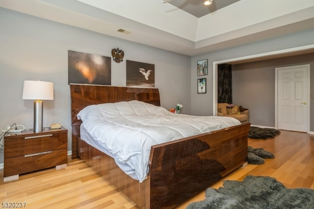 bedroom featuring light hardwood / wood-style floors and a closet