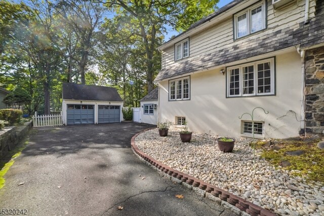 exterior space featuring an outbuilding and a garage