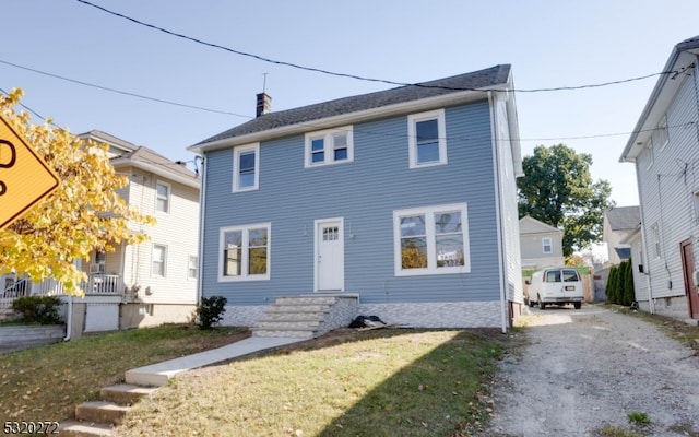 view of front of home with a front lawn