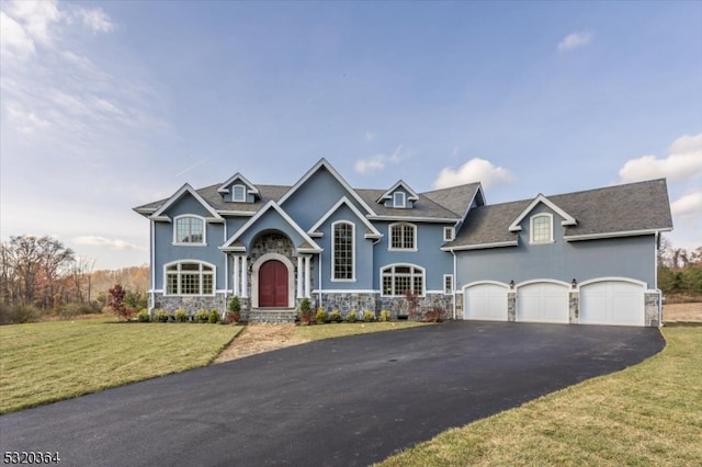 craftsman-style home featuring a garage and a front yard