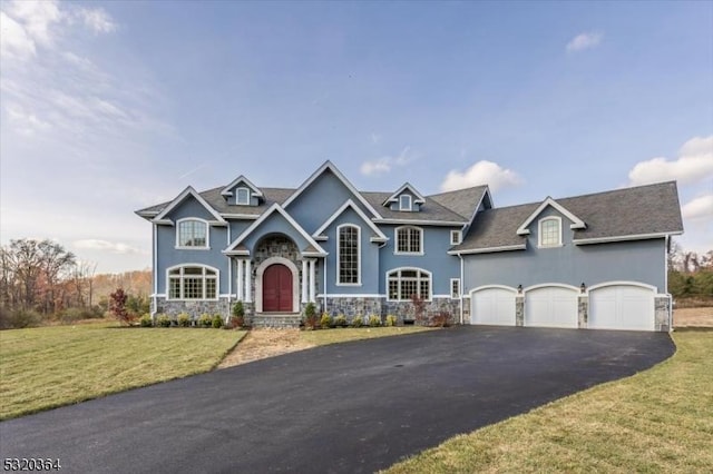 4 Hall Rd, Chester Twp, NJ 07930 - view of front of house featuring stone siding, asphalt driveway, stucco siding, an attached garage, and a front lawn