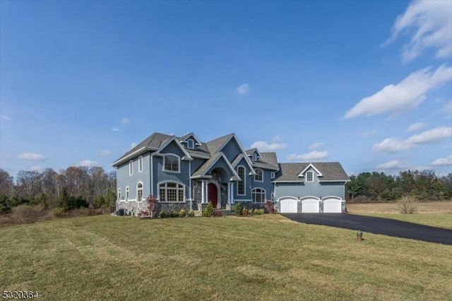 4 Hall Rd, Chester Twp, NJ 07930 - view of front of home with driveway, a front lawn, a garage, and stucco siding