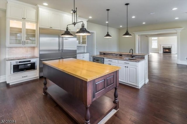 4 Hall Rd, Chester Twp, NJ 07930 - kitchen with an island with sink, a sink, stainless steel appliances, dark wood-style floors, and recessed lighting