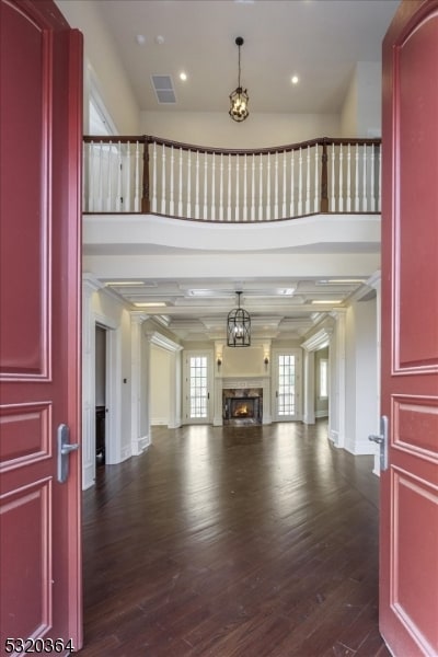 unfurnished living room with dark hardwood / wood-style floors