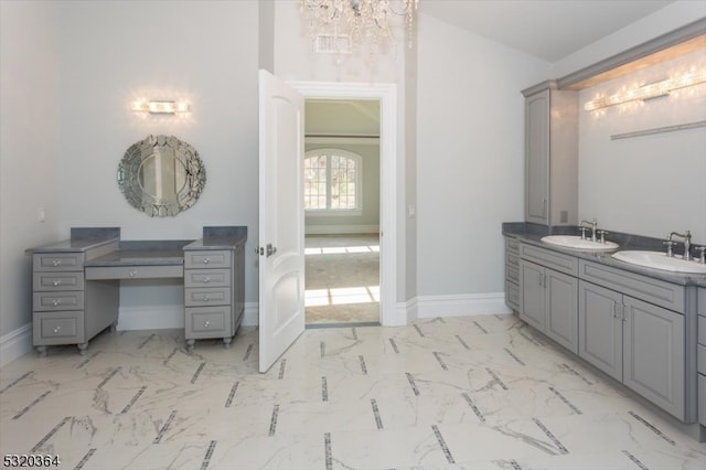 bathroom featuring vanity and a chandelier