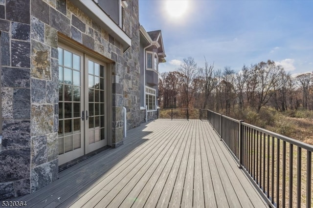 wooden deck featuring french doors