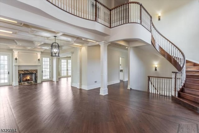 4 Hall Rd, Chester Twp, NJ 07930 - unfurnished living room featuring wood finished floors, a premium fireplace, decorative columns, stairs, and baseboards