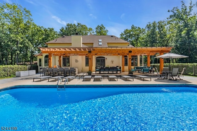 view of pool featuring an outdoor living space, a patio area, and a pergola