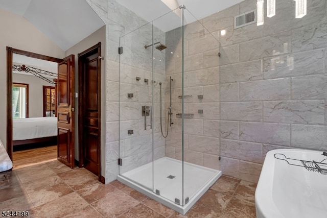 bathroom with independent shower and bath, lofted ceiling, and tile walls