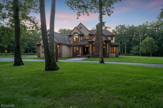 view of front of home with a yard