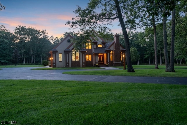 view of front of house with a lawn