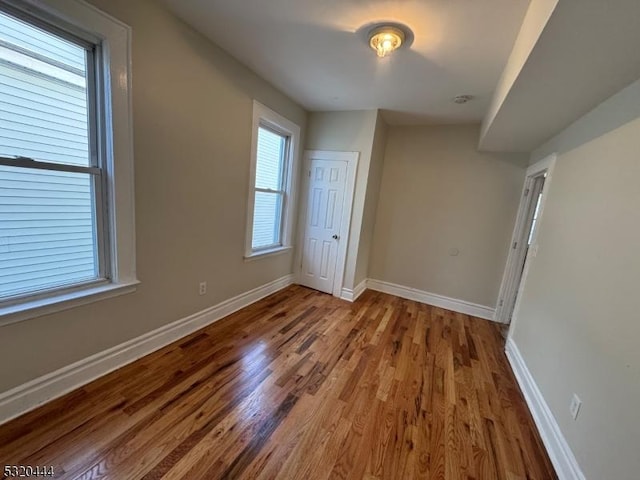 unfurnished bedroom featuring hardwood / wood-style flooring