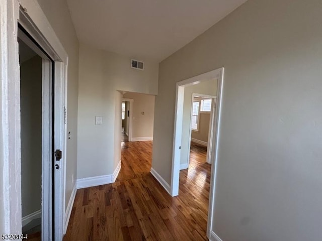 hall featuring dark wood-type flooring