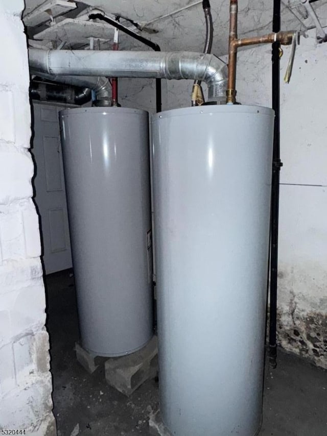 utility room featuring water heater