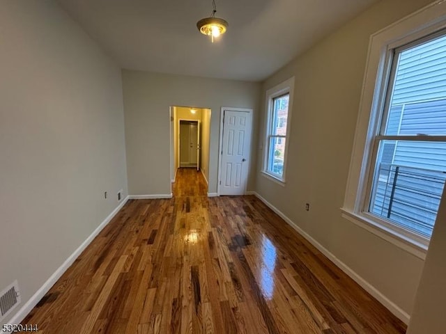 unfurnished bedroom featuring wood-type flooring