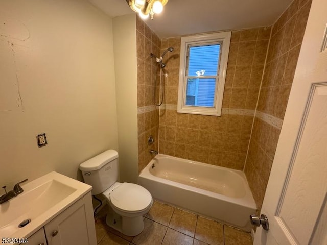 full bathroom with tile patterned floors, vanity, toilet, and tiled shower / bath