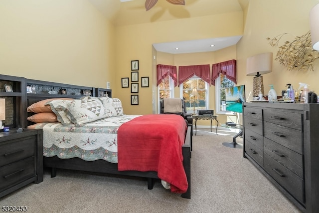 bedroom featuring ceiling fan and carpet