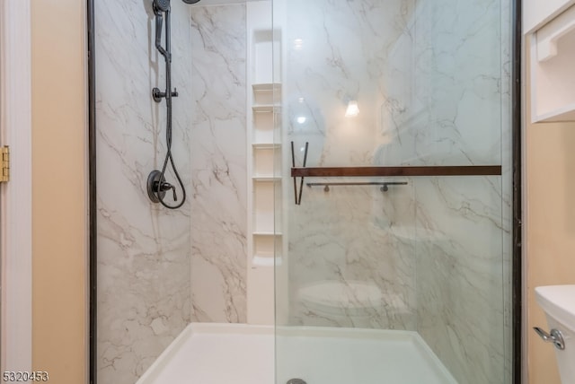 bathroom featuring an enclosed shower